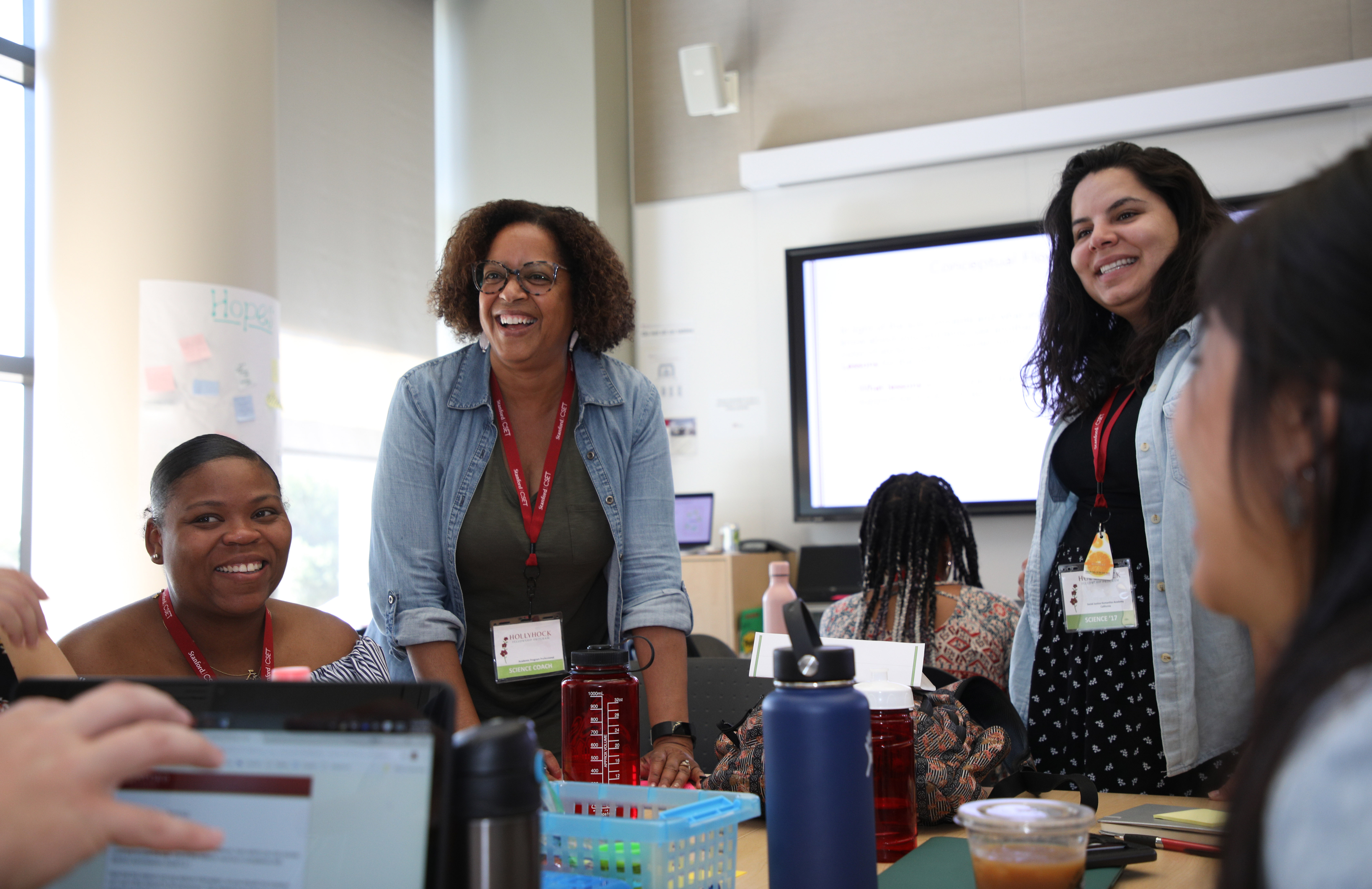 Teachers smiling across the table