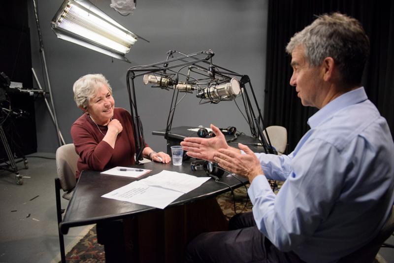 Dan Schwartz and Rachel Lotan speaking at a podcast