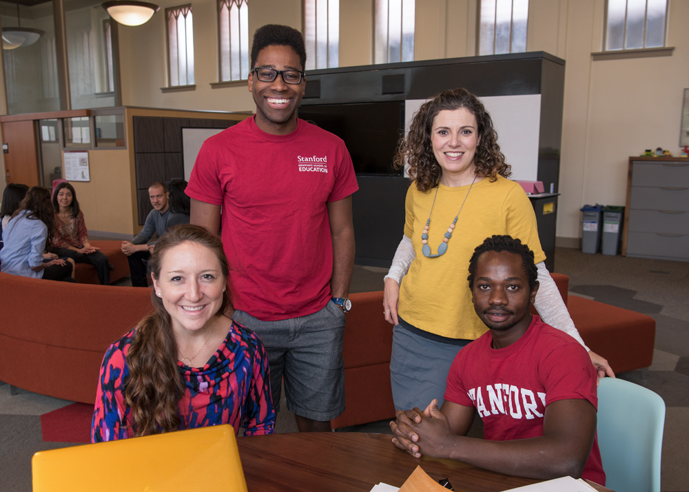 Four students looking at the camera