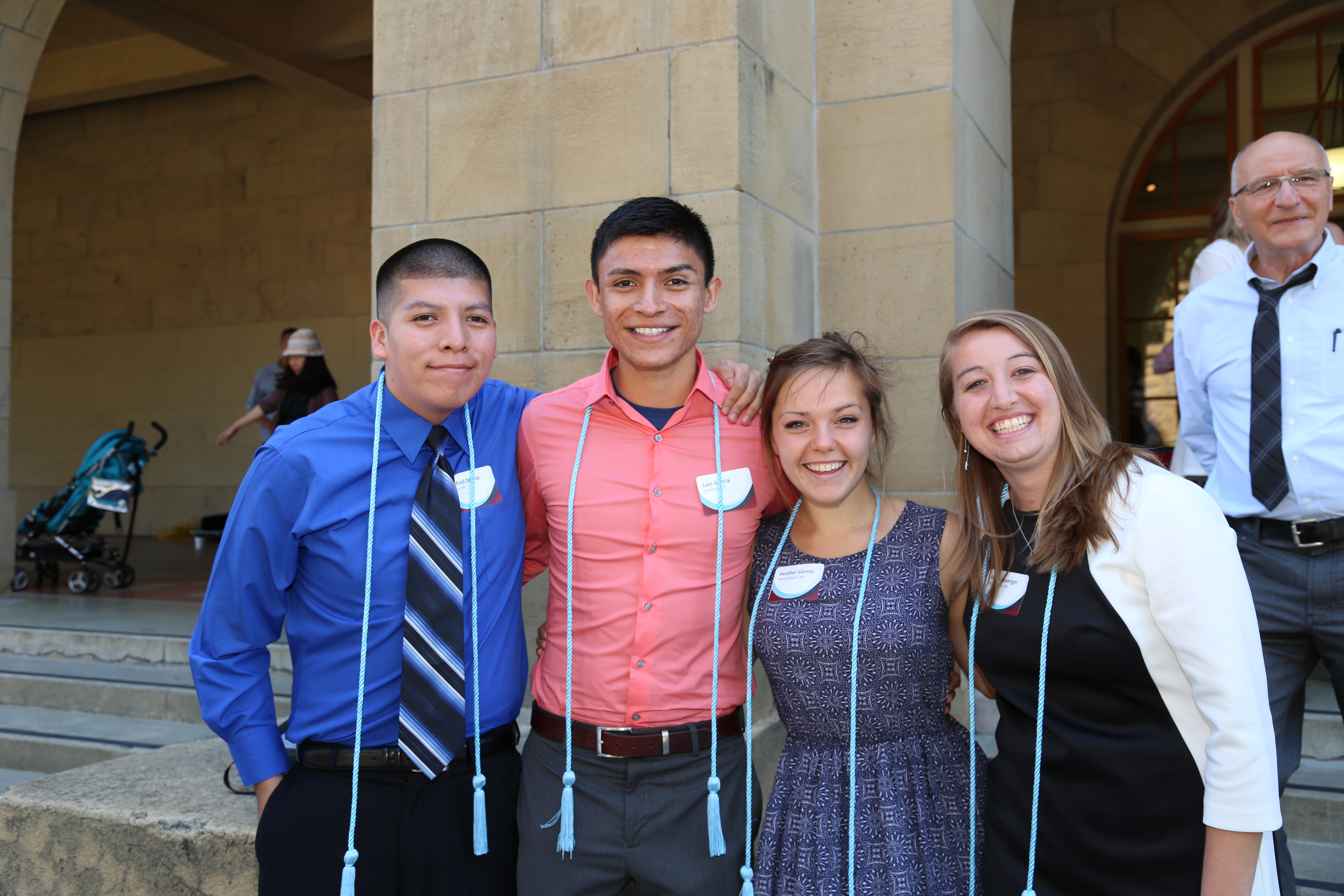 Photo of four students during GSE honor cord ceremony