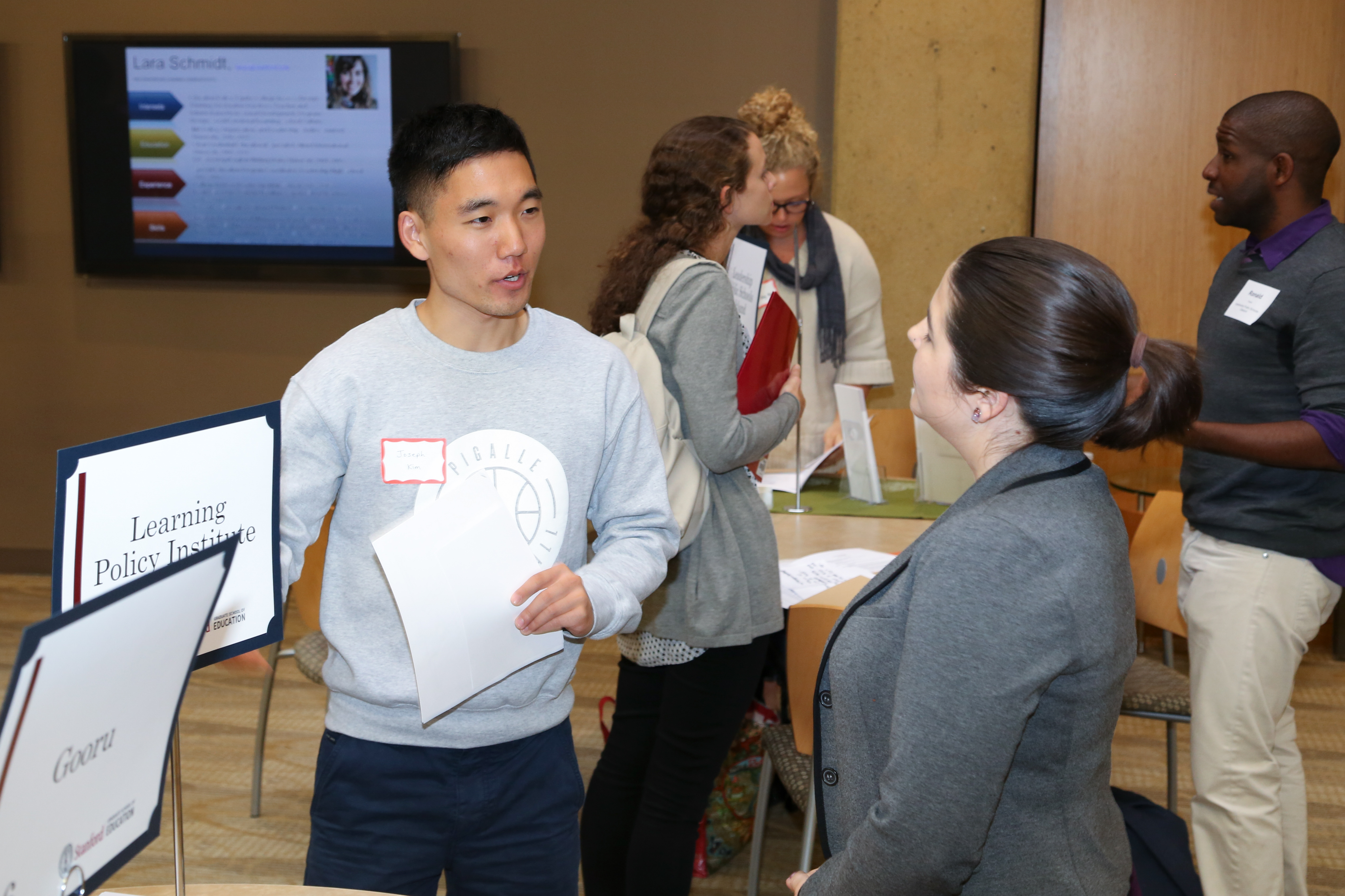 Two attendees conversing at an event.