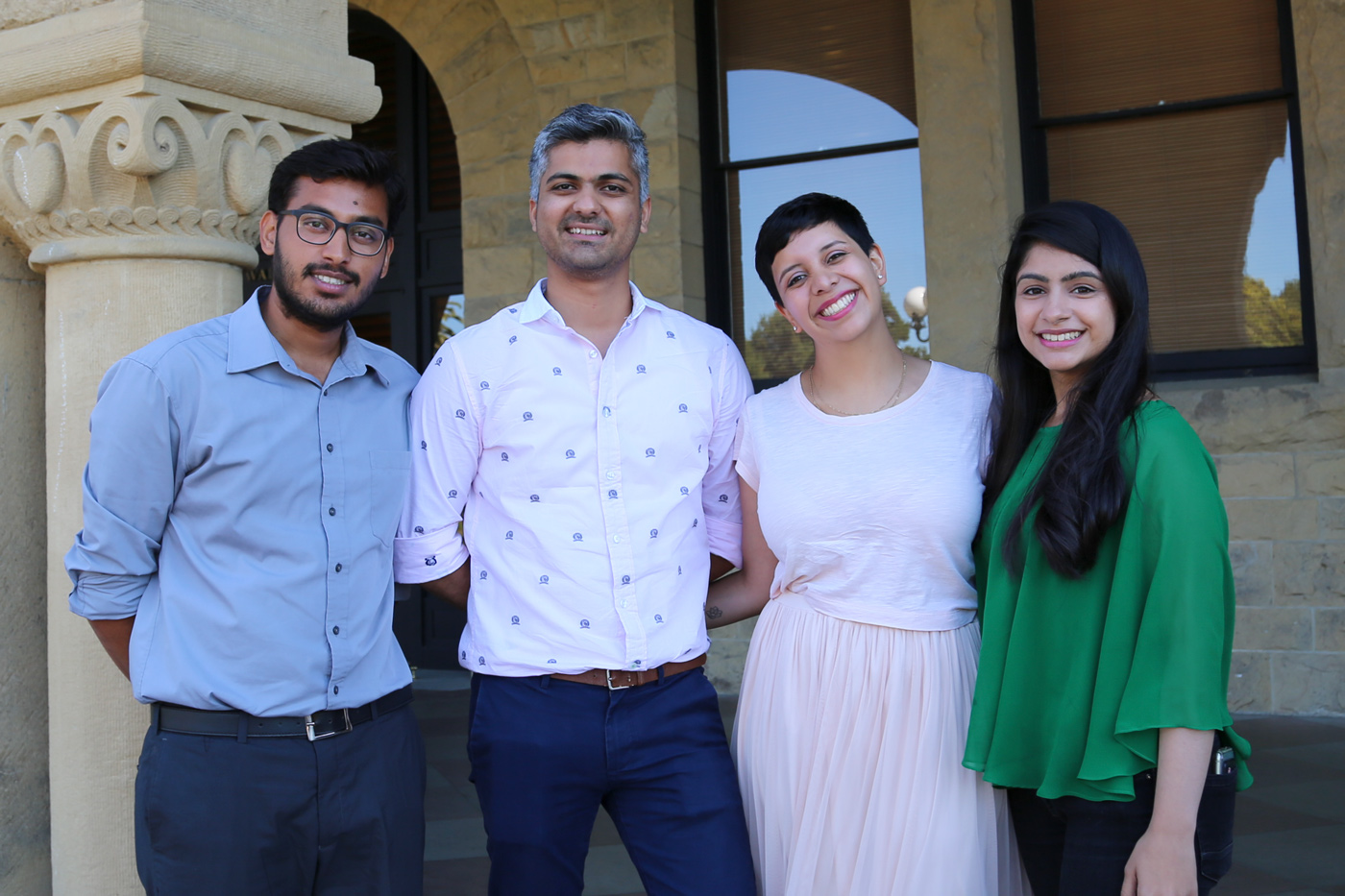 Four ICE Students standing in front of a Stanford building