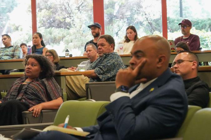 Participants (including Professor Bryan A. Brown, in foreground, and Professor Emeritus John Baugh, center background) look on and listen during the third annual Ball Lecture