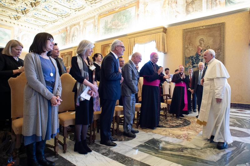 Photo of the pope greeting researchers