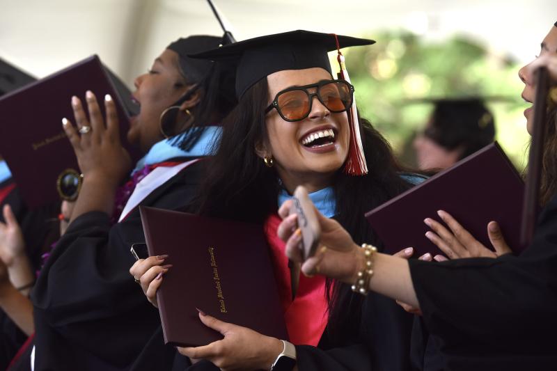 GSE students cheer as fellow graduates receive their diplomas on Sunday, June 16. (Photo: Charles Russo)