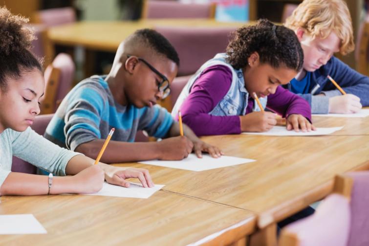 Students in a classroom taking a test