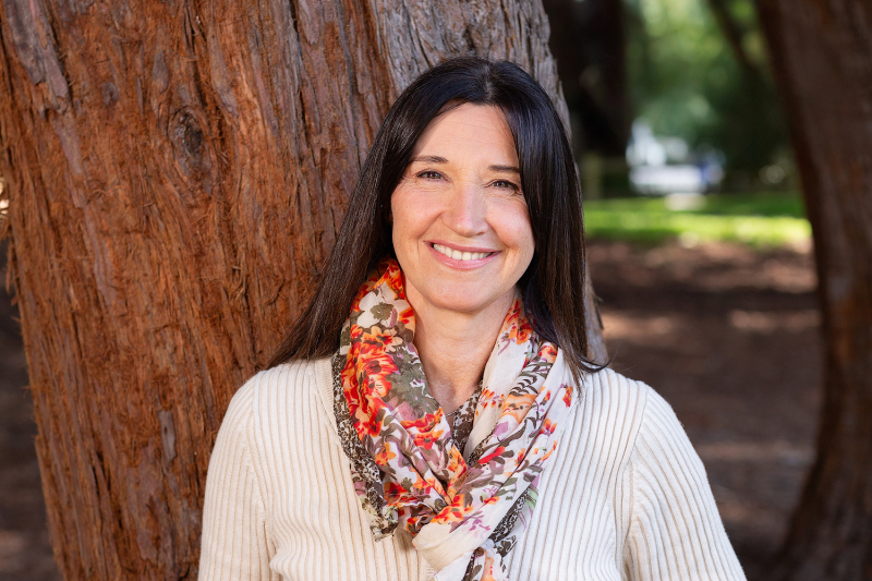 Woman in front of tree