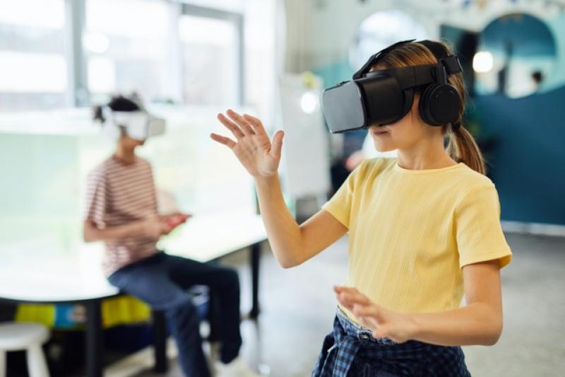 Two children using VR headsets