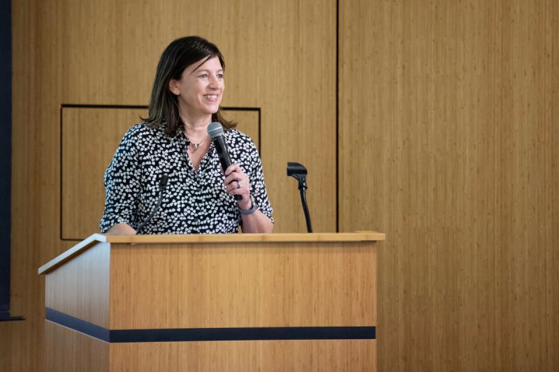 Professor Boaler speaking at the podium.