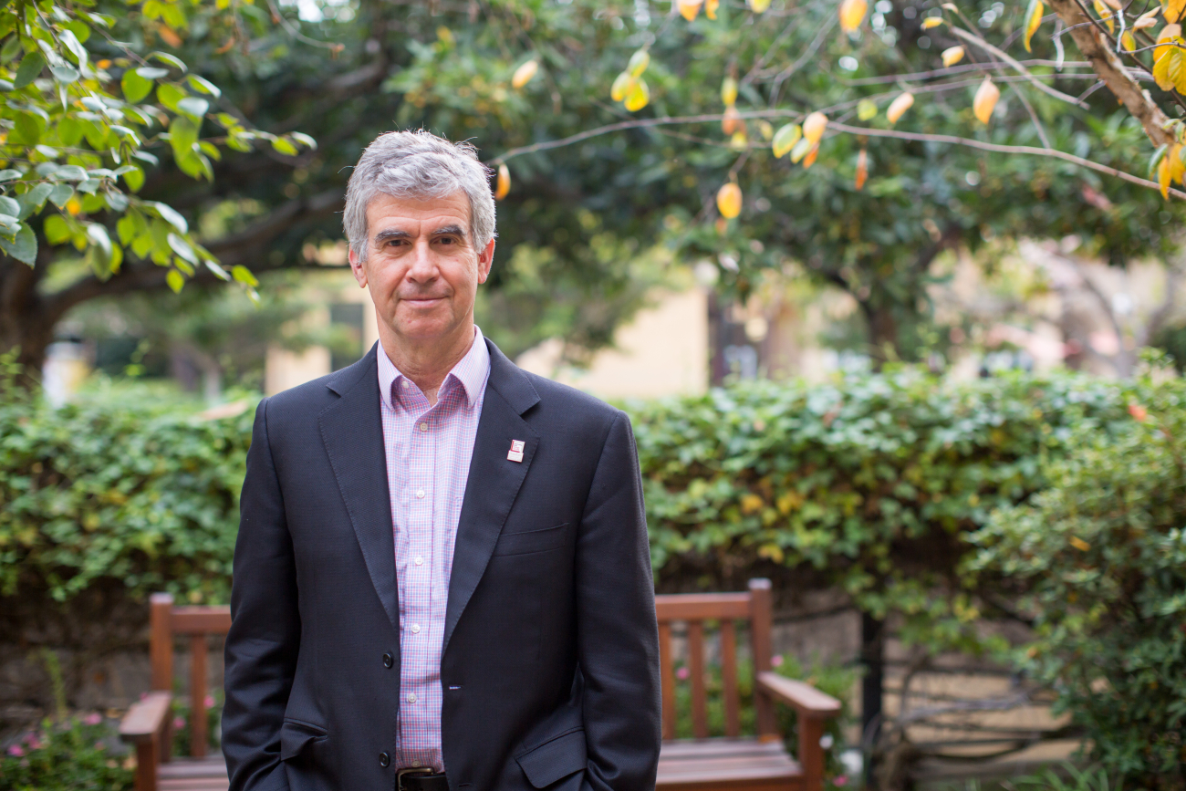 Portrait of GSE Dean Dan Schwartz standing in a garden by Holly Hernandez