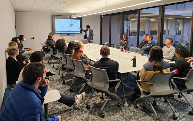 Albaraa Basfar, a Stanford postdoc in a pilot fellowship program led by the GSE and the School of Medicine, presents research in progress at a meeting in March. 