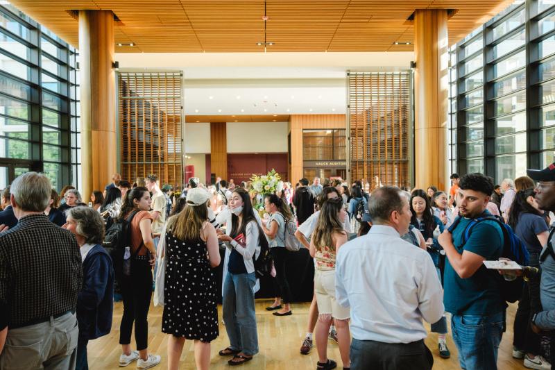 Attendees network and congregate at a reception before the lecture begins. (Photo: Ryan Zhang)