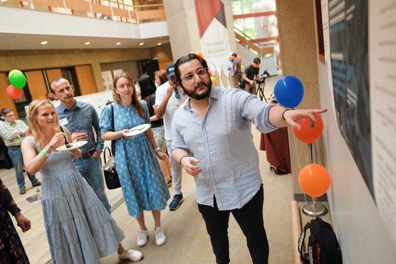 Othman Bensouda Koraichi, MS ’23, shares his work on a dropout early warning system. (Photo: Ryan Zhang)