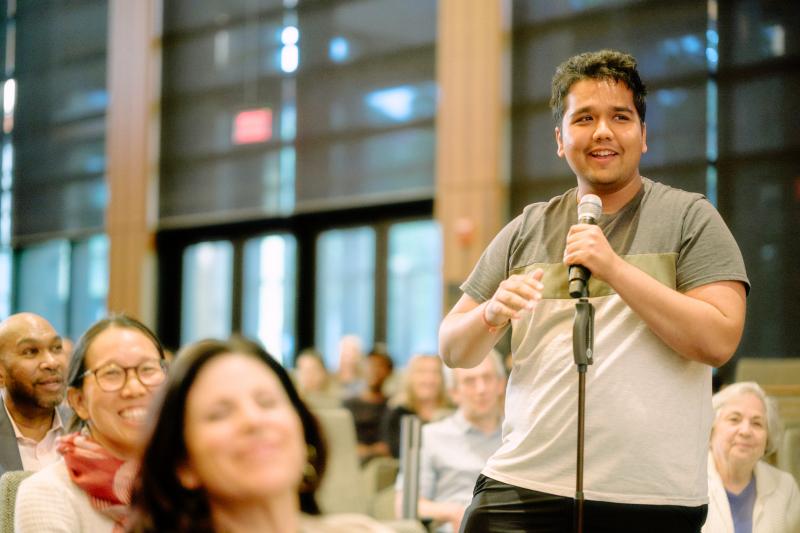 A community member asks the panelists a question during the Q&A portion of the event. (Photo: Ryan Zhang)