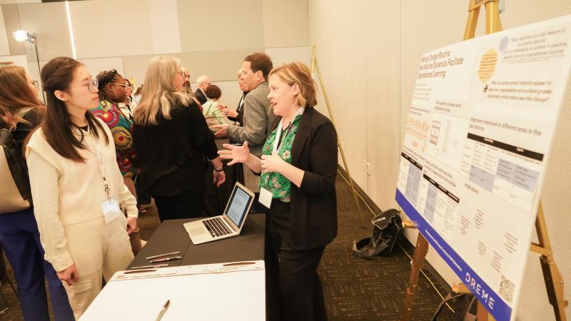 Bethany Elston, a researcher at Northwestern University, shares her team's exhibit on how districts can move toward greater preK-3 alignment and continuity. (Photo: Marc Franklin)