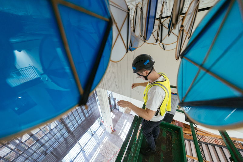 The entire installation weighs just over 2,600 pounds and is strung on 17 miles of spectra thread. Here, Wade Cotton ensures the kites are properly placed. (Photo: Andrew Brodhead)