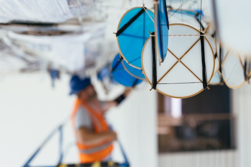 Each of the 6,300 kites is crafted from handmade washi paper supported by thin bamboo frames, and needed to be individually uncoiled from the spectra thread that suspends it. (Photo: Andrew Brodhead)