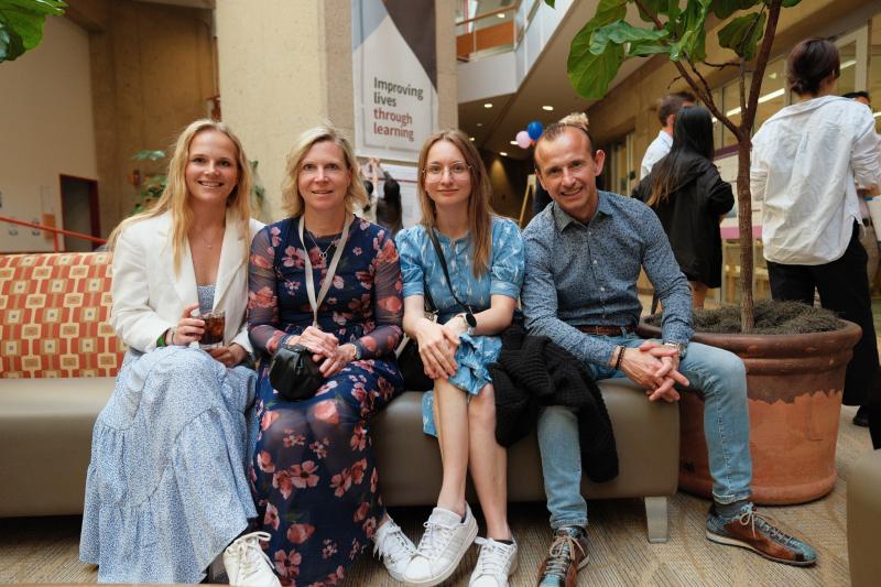 Anna-Julia Storch, MS ’23 (left), sits with family at the symposium. (Photo: Ryan Zhang)