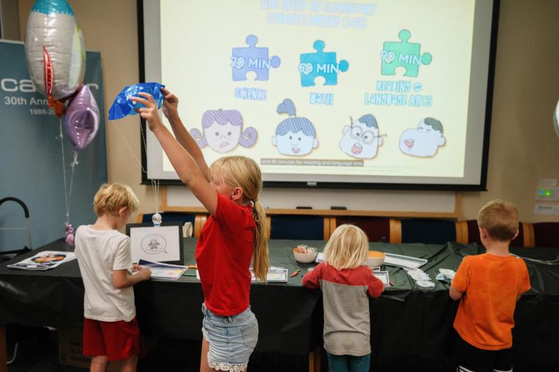 Young learners explore Curious Conversations, a project by Tran Bao Hoang and Zoha Salman, developed to engage children in science.