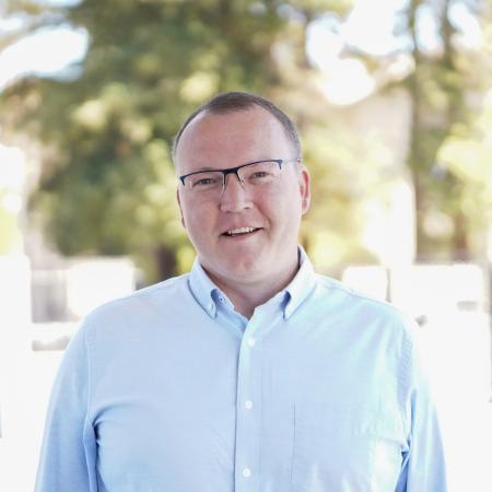 David Heinke, smiling, in an outside photo