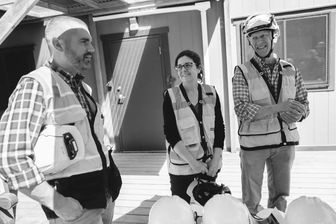 Jeff Ivey (left) chats with Olivia Crawford (center) and Michael Mithen (right) before a faculty tour of construction. 