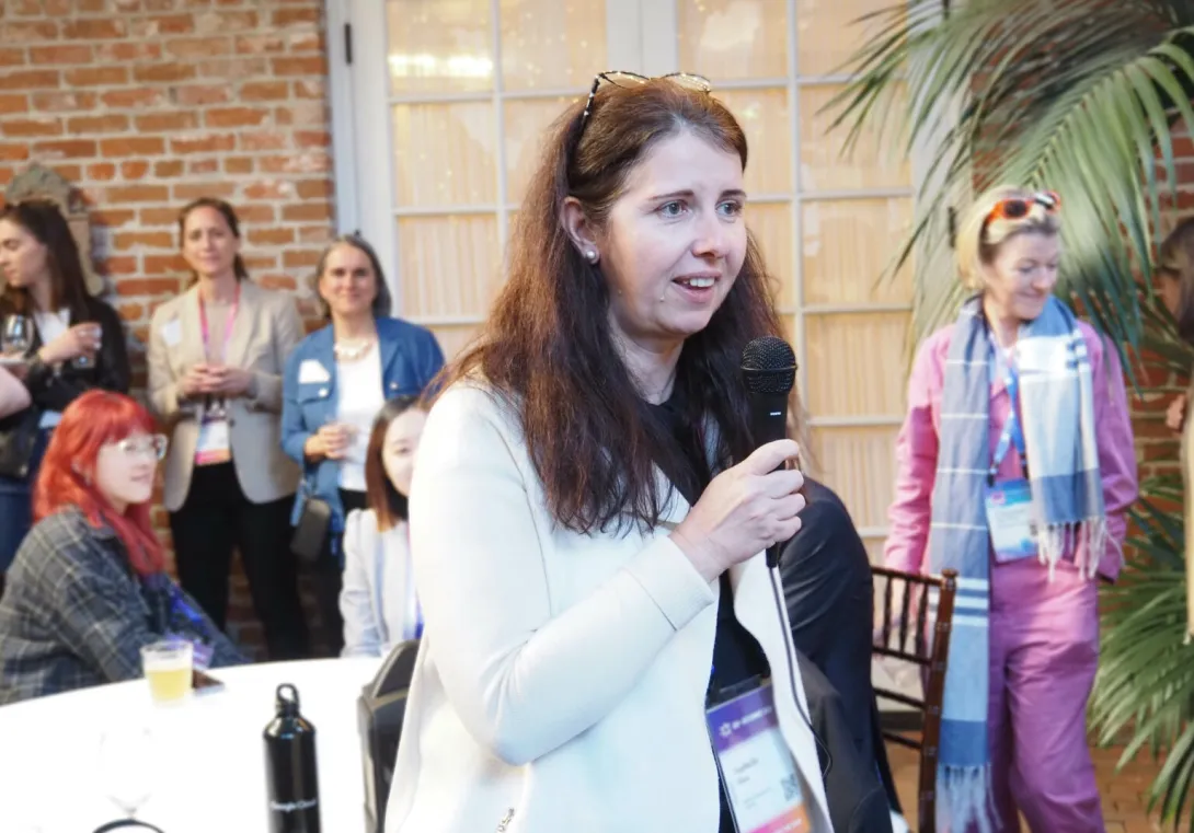 Isabelle Hau, executive director of the Stanford Accelerator for Learning, welcomes guests to a cocktail hour.