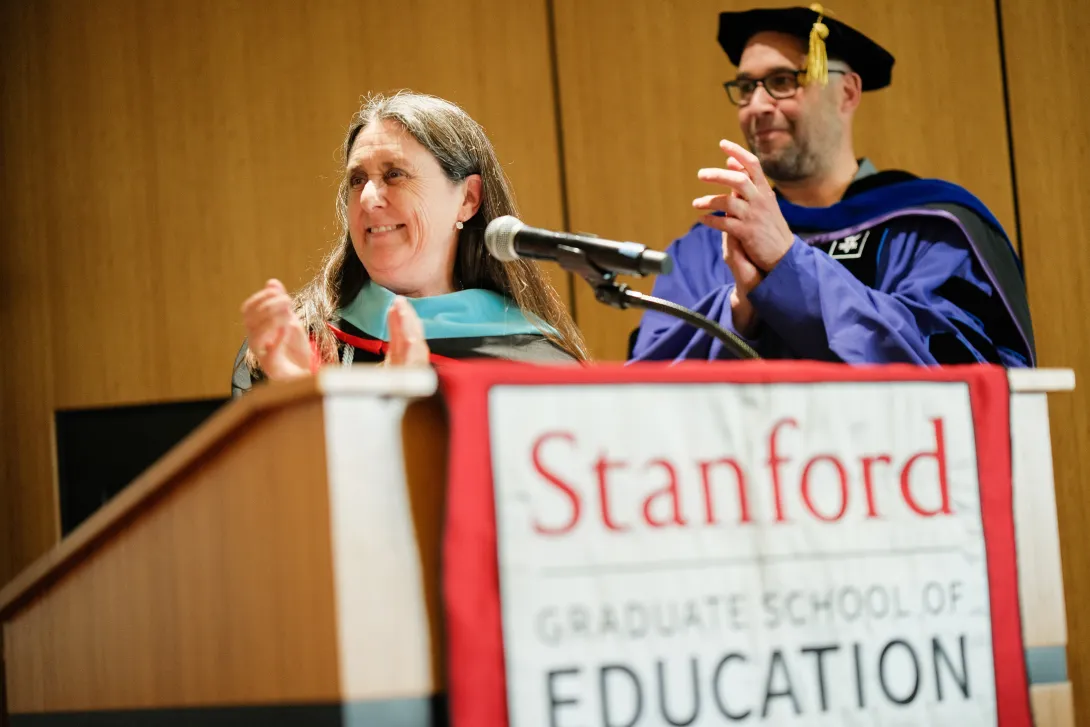 Jennifer Wolf (left) and Ari Kelman (right) applaud at the 023 UP@GSE cord ceremony. (Photo: Ryan Zhang)