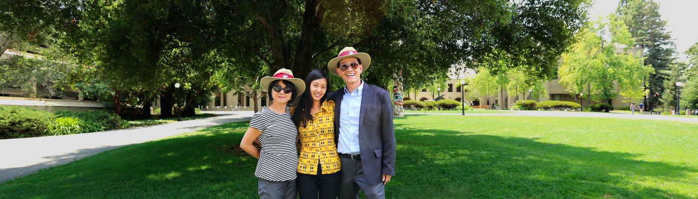 Photo of a student and her family on campus