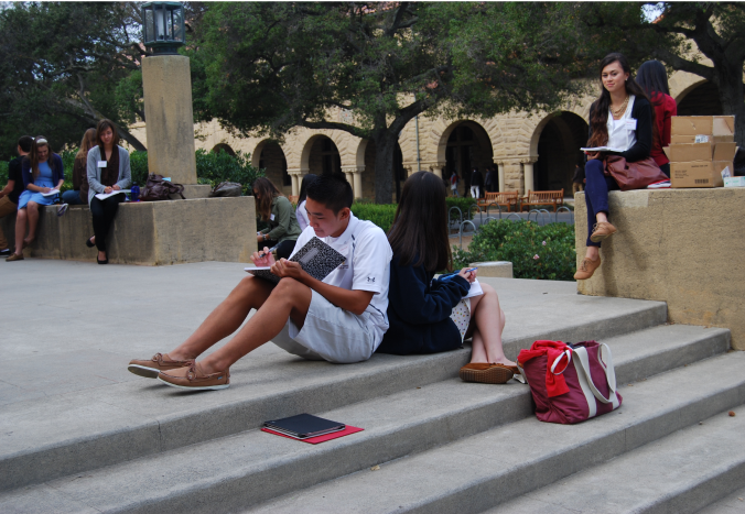 Two students studying on campus steps