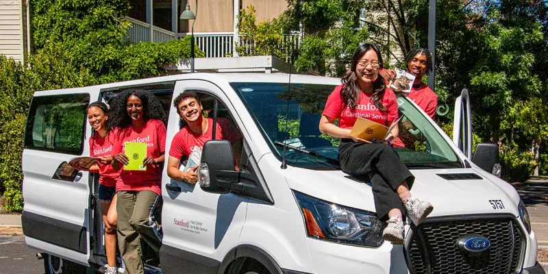 Ravenswood Reads students in a van with books