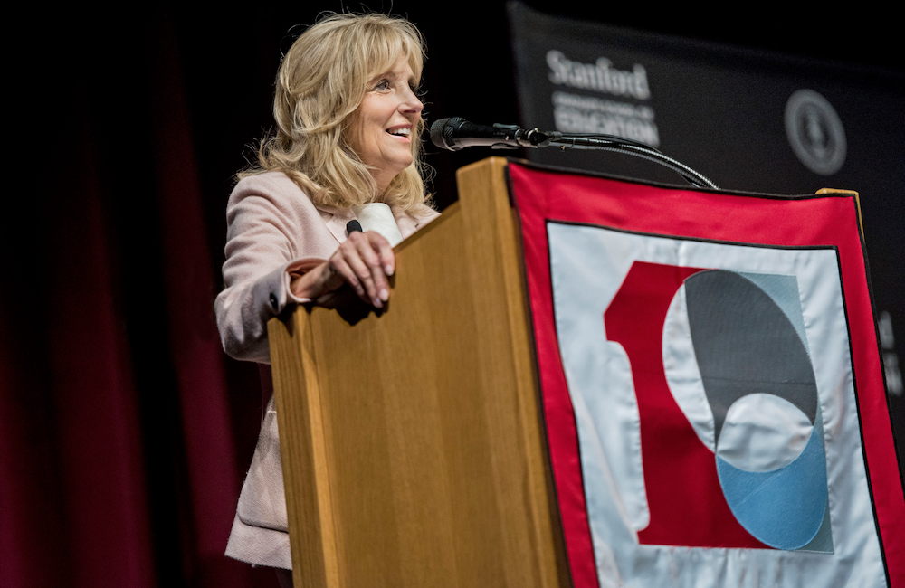 Photo of Jill Biden speaking over a podium.