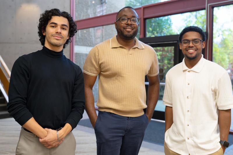 Stanford GSE assistant Professor Mike Hines (center) with STEP students Emilio Luna (left) and De’Jshon Maxwell-Garcia (right), who took his pilot course on the history of education in California.