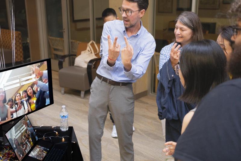 LDT student Brent Johnson shows guests how to interact with his project Quizeo.ai.