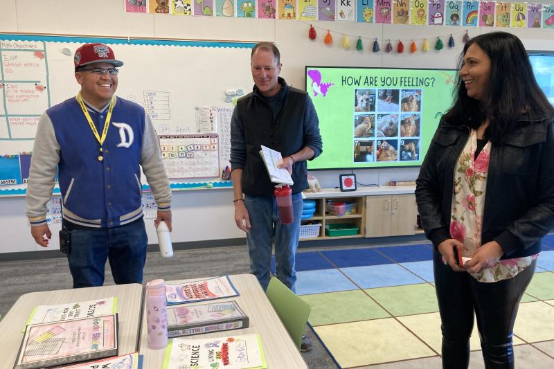 Jonny Hernandez, a paraeducator at Abram Agnew Elementary School, with GSE Associate Professor Chris Lemons and Stanford researcher Lakshmi Balasubramian. (Photo: Lisa Chung)