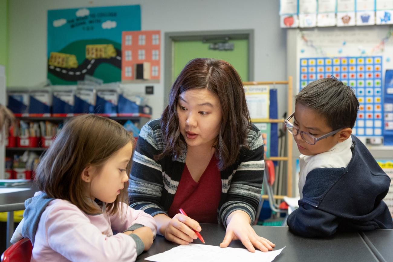 Children with teacher in an elementary school classroom