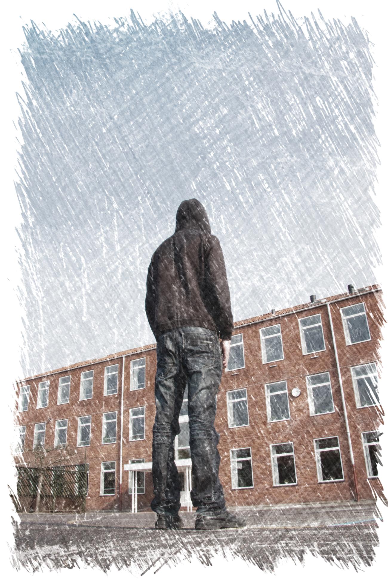 Image of young man outside of a school